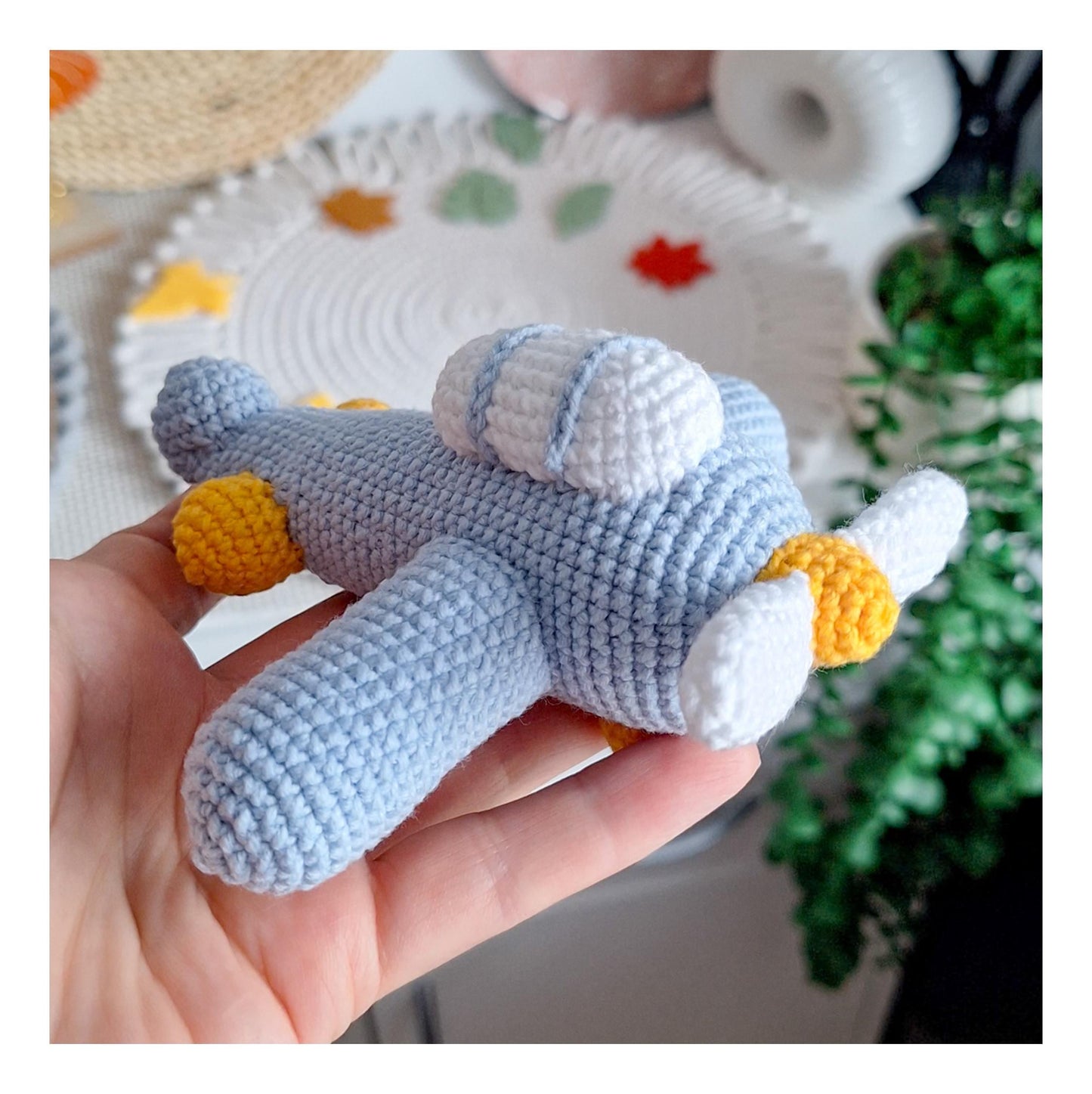 Amigurumi airplane keychain handmade from cotton yarn