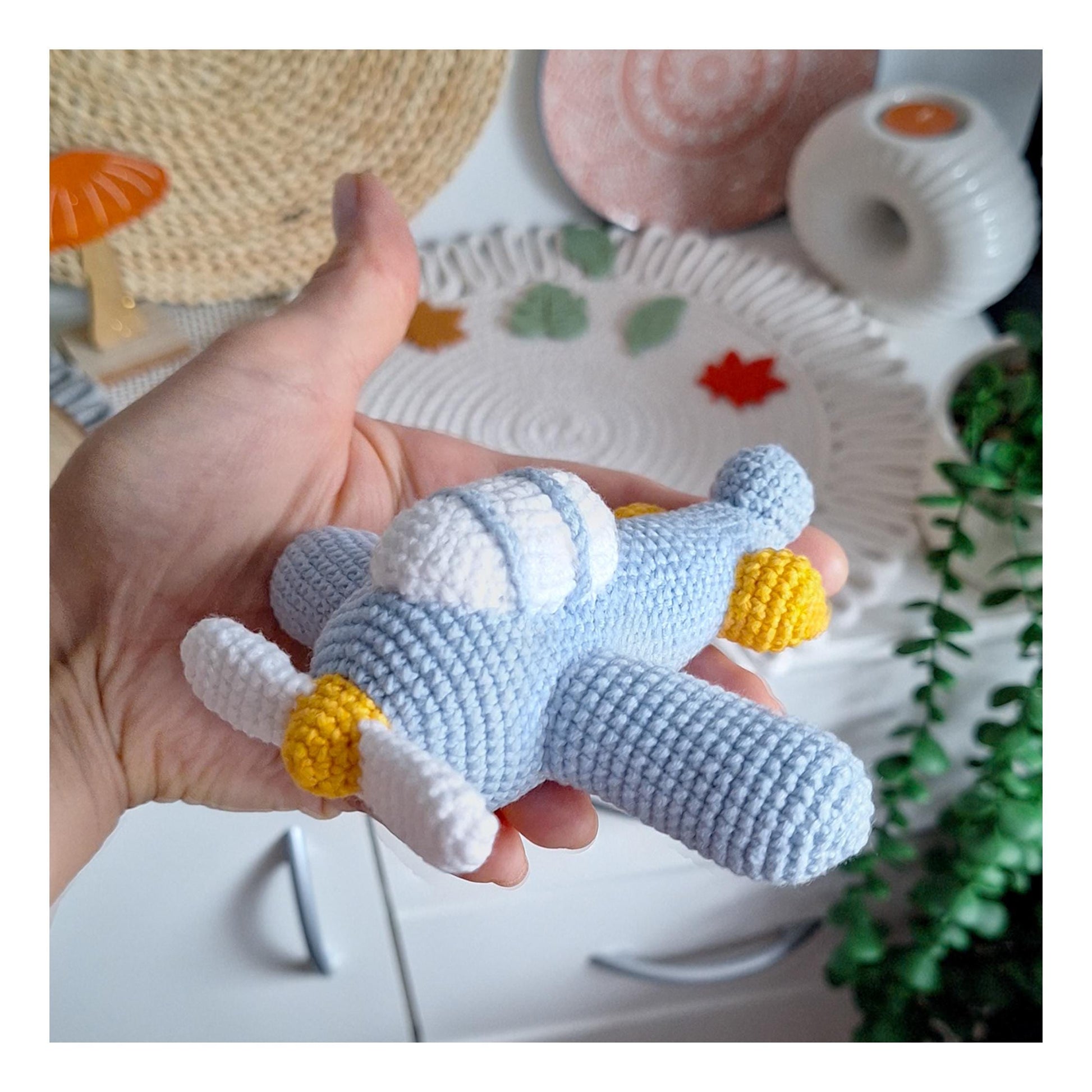 Handmade crochet airplane plush toy keychain in blue yarn